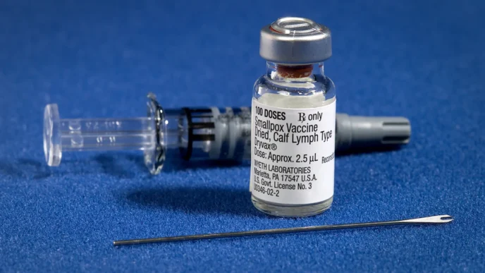 Smallpox vaccination kit including and a bifurcated needle