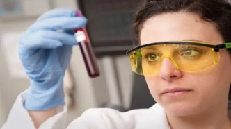 Female doctor checking a blood sample in a laboratory
