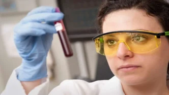 Female doctor checking a blood sample in a laboratory