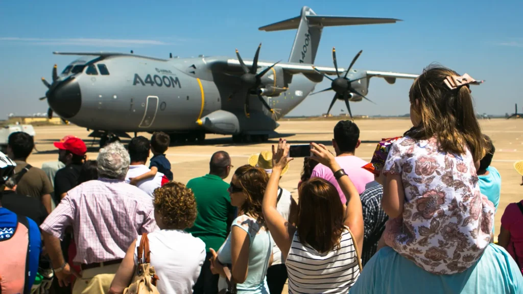 Guests at the 75th Anniversary celebration of Morón Air Base, Spain, photograph a Spanish Airbus A400M Atlas after it landed during a demonstration May 31, 2015.